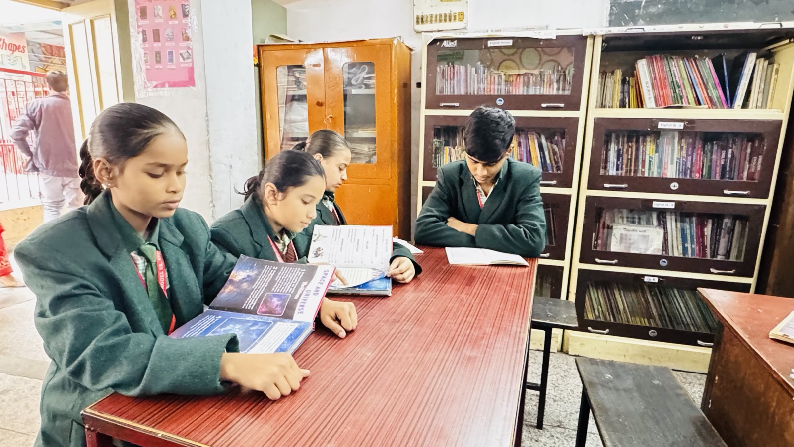 Students reading together in the library — Jyoti Model Sr. Secondary School