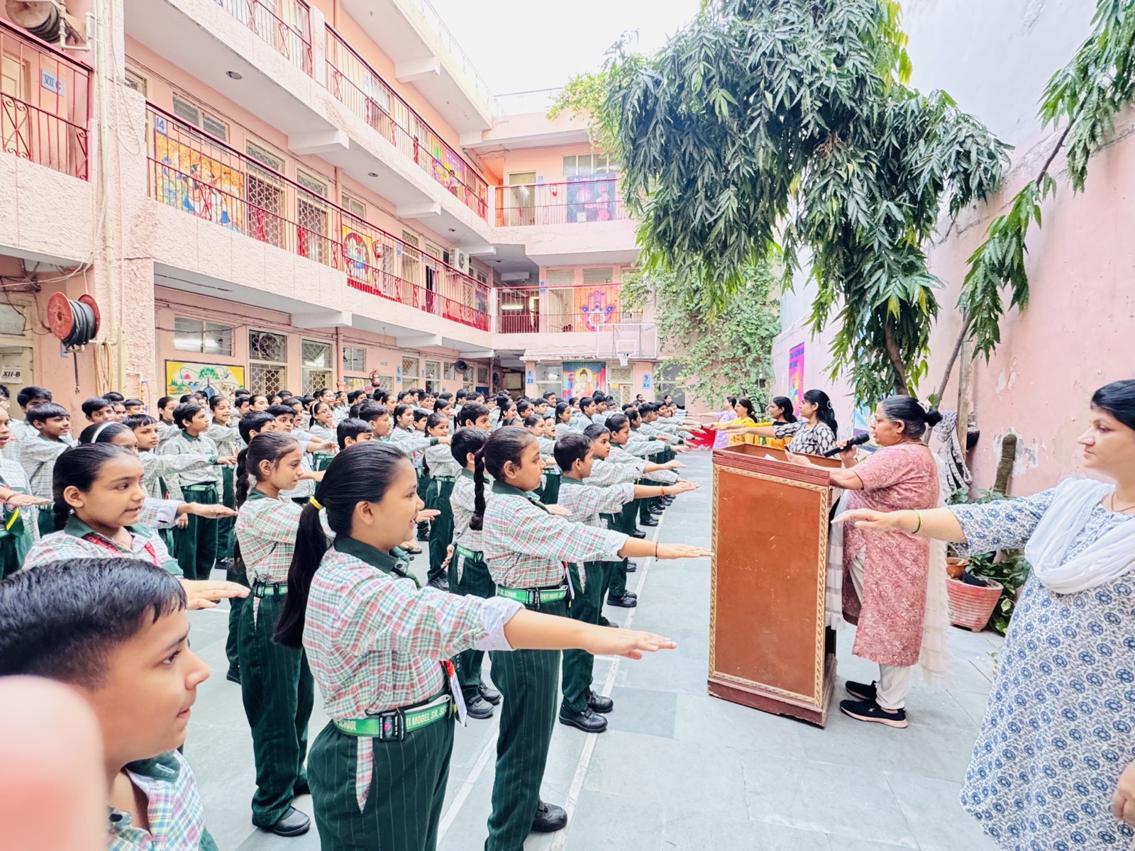 Students taking the pledge at morning assembly