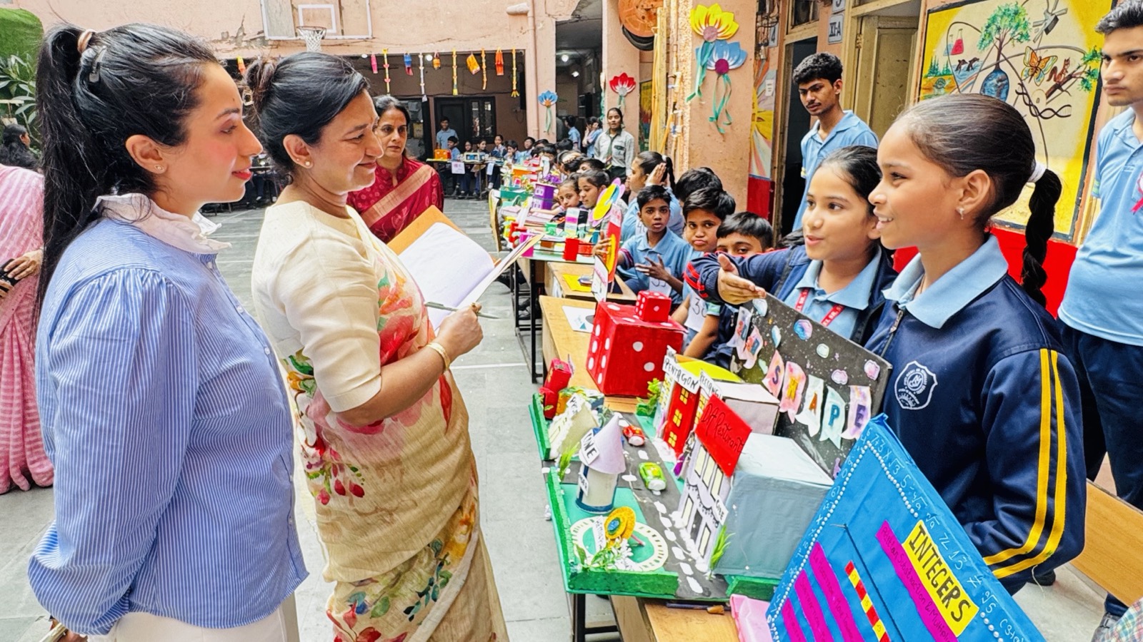 Teachers and students of Jyoti Model Sr. Secondary School at a maths exhibition on campus