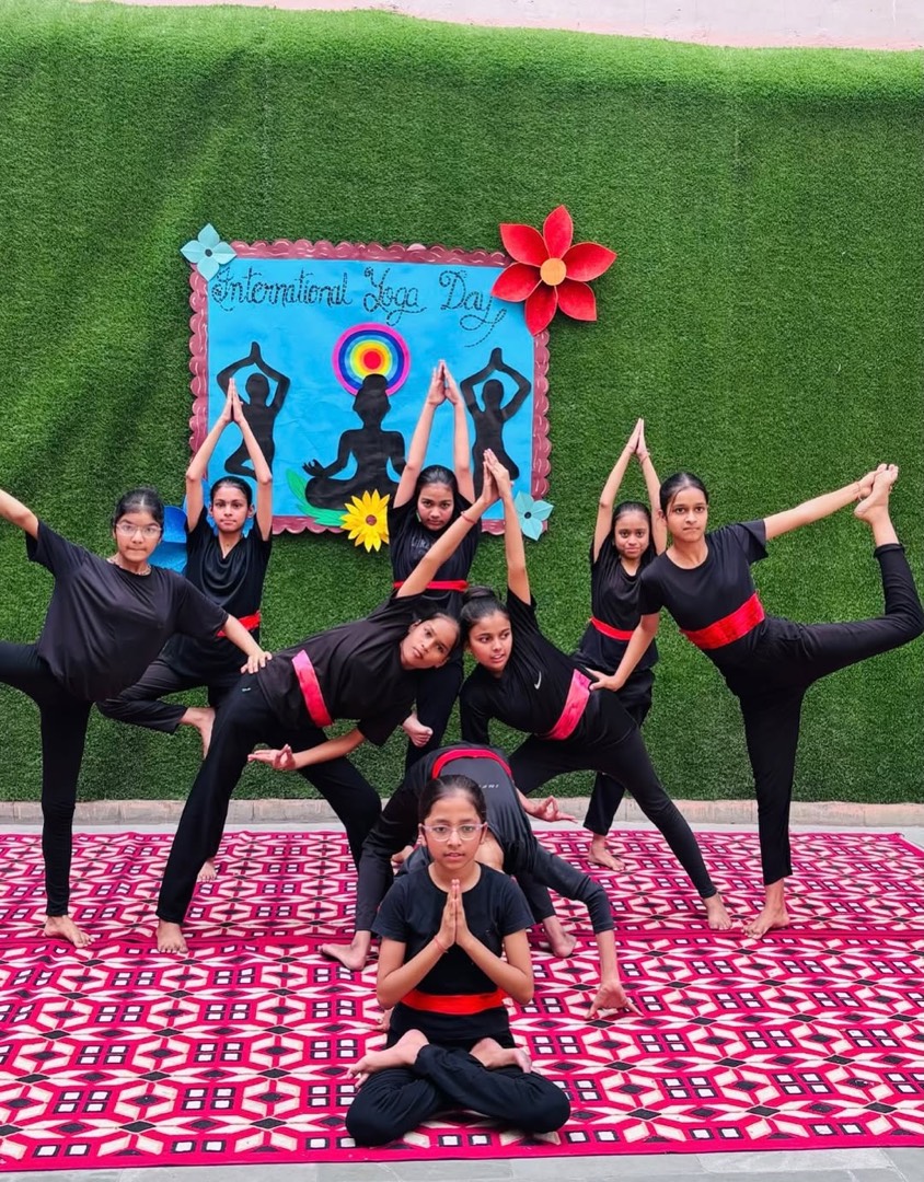 Students of Jyoti Model Sr. Secondary School in a yoga formation on campus